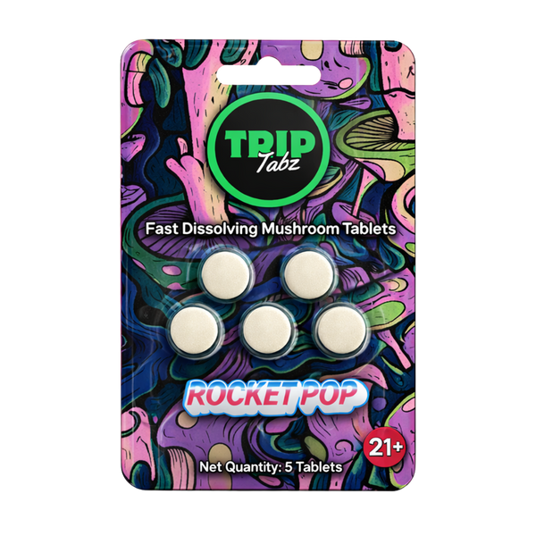 Pack of fast dissolving mushroom tablets with colorful packaging and 'TRIP Tabz' branding.